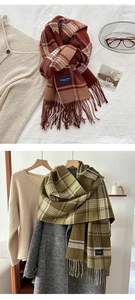 Close-up of fringe details and elegant classic labels on striped plaid scarves