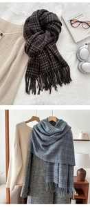 Detail of winter plaid tassel scarf in coffee and blue tones with soft wool-like texture