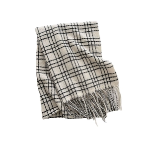 Classic black and white checkered wool scarf with handmade tassels for winter warmth