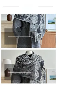 Detail of dark grey paisley cashmere-feel scarf with fine fringe edges and soft texture