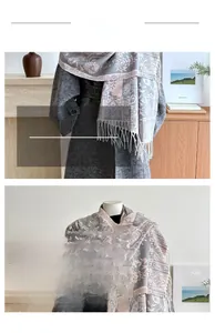 Detail of grey and pink paisley jacquard scarf with decorative fringe tassels