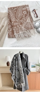 Detail of paisley pashmina shawl with fringes styled with a coat and accessories