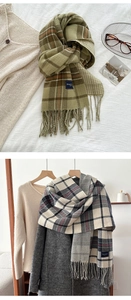Detail of soft plaid scarves with fringe, including classic green and gray check patterns