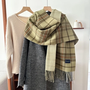 Thick knit plaid scarf with tassels and fringe in green and brown for winter warmth