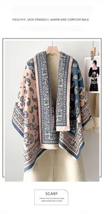 Close-up of navy and pink paisley jacquard pattern scarf with delicate fringe edges