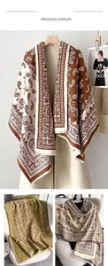 Detail of bohemian paisley shawl with thick knit fabric and elegant fringe edges