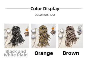 Flat lay of vintage plaid scarves in black, orange, and brown with tassel details