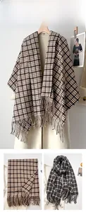 Detail of vintage houndstooth scarf with classic fringe edges and thick woven texture