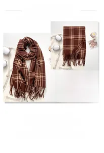Close-up of thick brown plaid scarf with fringe tassels and soft cashmere texture