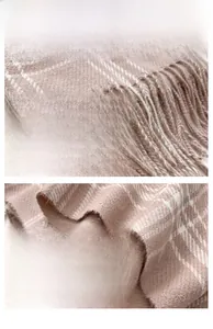 Detailed view of pink and brown plaid scarf featuring soft fringe and twill weave texture