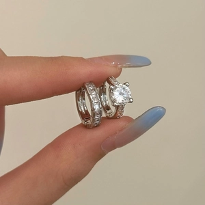 Sparkling silver zircon earrings set with round cut stone and crystal hoop details