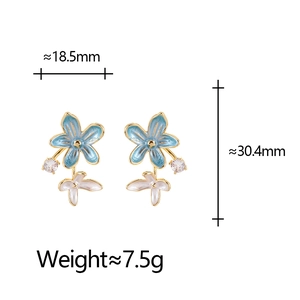 Detailed view of floral earrings with enamel petals and crystal including dimensions