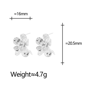 Elegant silver flower stud earrings with sparkling cubic zirconia and textured petals