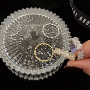 Detailed macro view of gold and silver rings with rectangular cubic zirconia stones