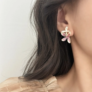 Pink enamel flower butterfly stud earrings with gold metal plating for a romantic look