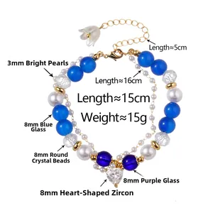 Detail view of double-layer beaded bracelet with blue glass beads and heart zircon