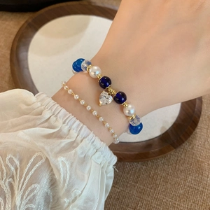 Double-layered beaded bracelet set with elegant heart-shaped zircon pendant and gold accents