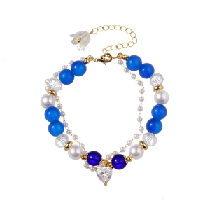 Beaded heart charm bracelet with blue crystal beads and lily of the valley pendant