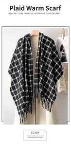 Detail view of the black and white checkered scarf with elegant tassel fringe edges