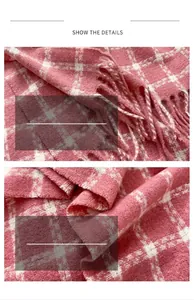 Detail showing the pink plaid pattern and soft wool-like fringe of the winter scarf