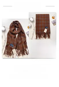 Detail of dark coffee plaid cashmere-like scarf with soft fringe and thick texture