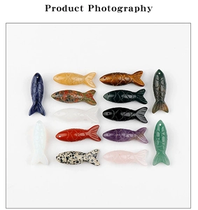 Macro view of assorted hand-carved fish-shaped natural gemstone pendants for DIY jewelry