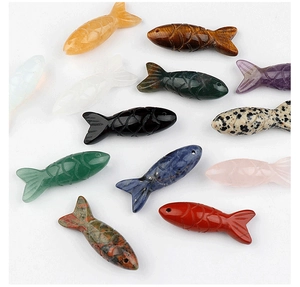 Macro view of detailed fish-shaped natural gemstones carvings for DIY jewelry making