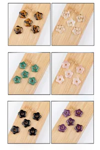 Detailed grid of flower-shaped natural stone beads including amethyst and tiger eye