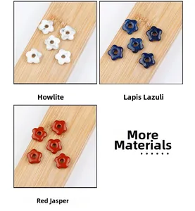 Macro detail of star-shaped Howlite, Lapis, and Red Jasper beads for jewelry making