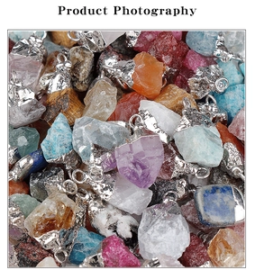 Close-up of assorted raw gemstone pendants with silver-plated bails in various colors