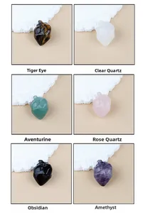 Detailed view of six natural stone heart pendants including Tiger Eye and Rose Quartz