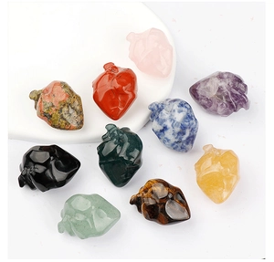 Close-up of assorted natural gemstone heart carvings with detailed anatomical textures