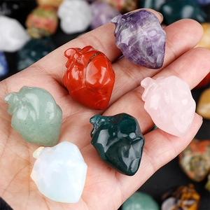 Mini natural crystal heart organ sculptures in various stones like amethyst and agate