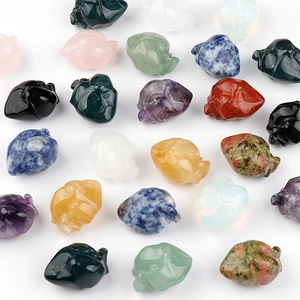 Assorted natural crystal and agate gemstone skull carvings for Halloween decor in multiple colors
