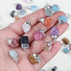 Natural amethyst and assorted raw crystal pendants with silver-plated edging details