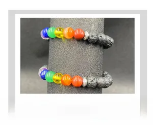 Detail of two 7 chakra bracelets with volcanic lava stones and silver spacers on stand