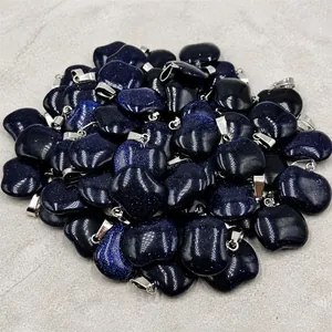 Close-up of blue sandstone apple pendants with sparkling starry texture and silver clasp