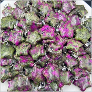 Detailed view of bulk ruby in zoisite star pendants with silver metal bails