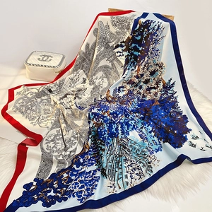 Detailed view of silk-like scarf with hand-drawn tropical patterns on plush background