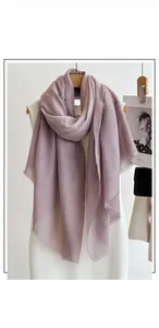 Detail of taro purple lightweight linen scarf featuring delicate short fringe edges