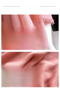 Detailed view of pink summer scarf with soft twill texture and delicate short fringes
