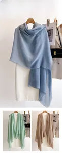 Macro detail of breathable solid color scarf showing delicate frayed edges and linen texture