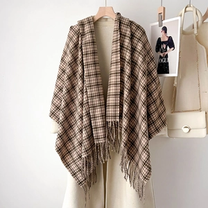 Classic checkered wine red and beige scarf with fringe over beige winter wool coat