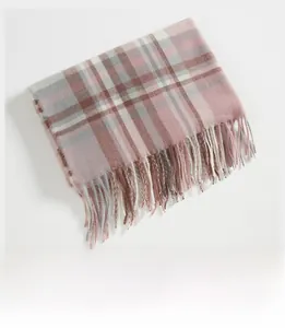 Close-up of soft pink and grey checkered scarf with delicate fringed tassel details