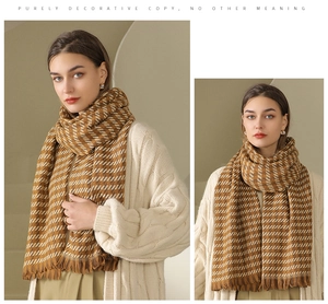 Detail of brown and white houndstooth scarf with soft tassels worn with a knit cardigan