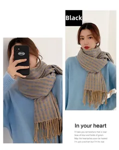 Detail view of khaki scarf with blue clover dots, soft cashmere-feel fabric and fringes