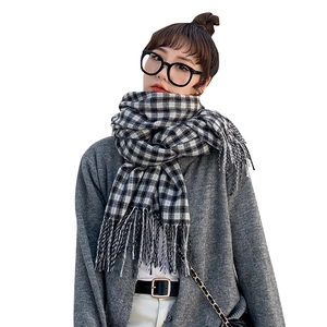 Classic black and white checkered thick winter scarf with decorative fringe details