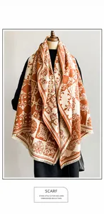 Detailed close-up of bohemian geometric jacquard patterns and fringe on the warm scarf