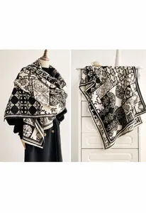 Detail of premium checkered cashmere-like winter scarf featuring elegant tassel edges