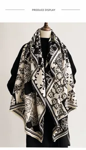 Detailed view of luxury cashmere-like scarf with baroque floral prints and fringe trim